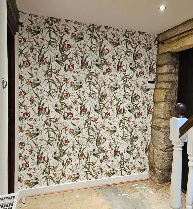 Botanical feature wallpaper beside a stone doorway